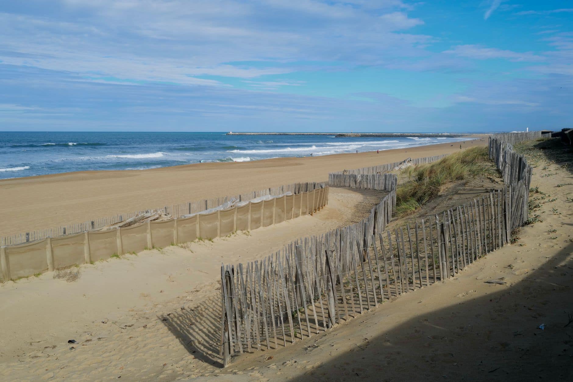 Explore the tranquil sandy dunes and ocean waves at Anglet beach, perfect for a summer getaway.