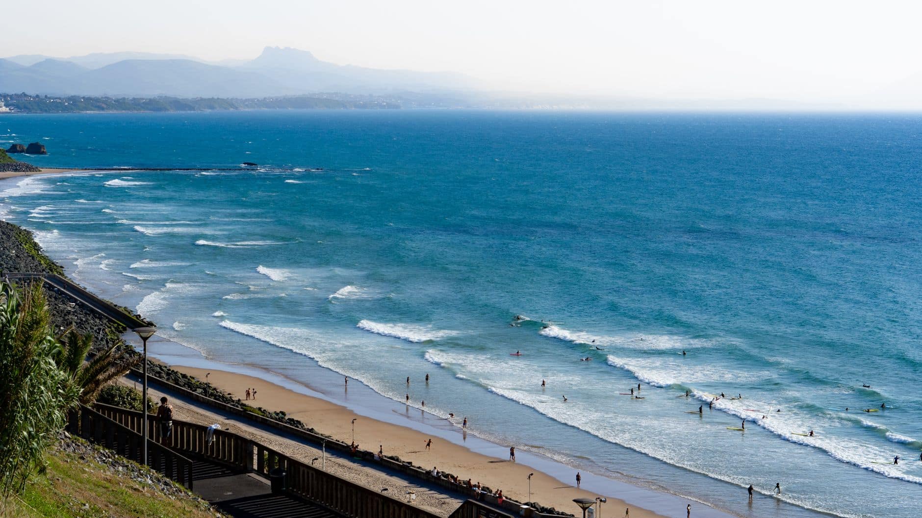 A breathtaking view of the Biarritz beach and ocean waves, perfect for summer travel inspiration.