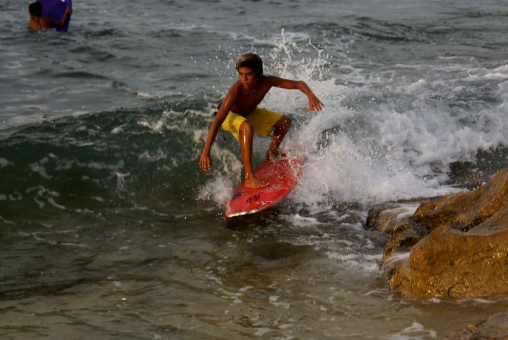 Kids surfing in Bingin
