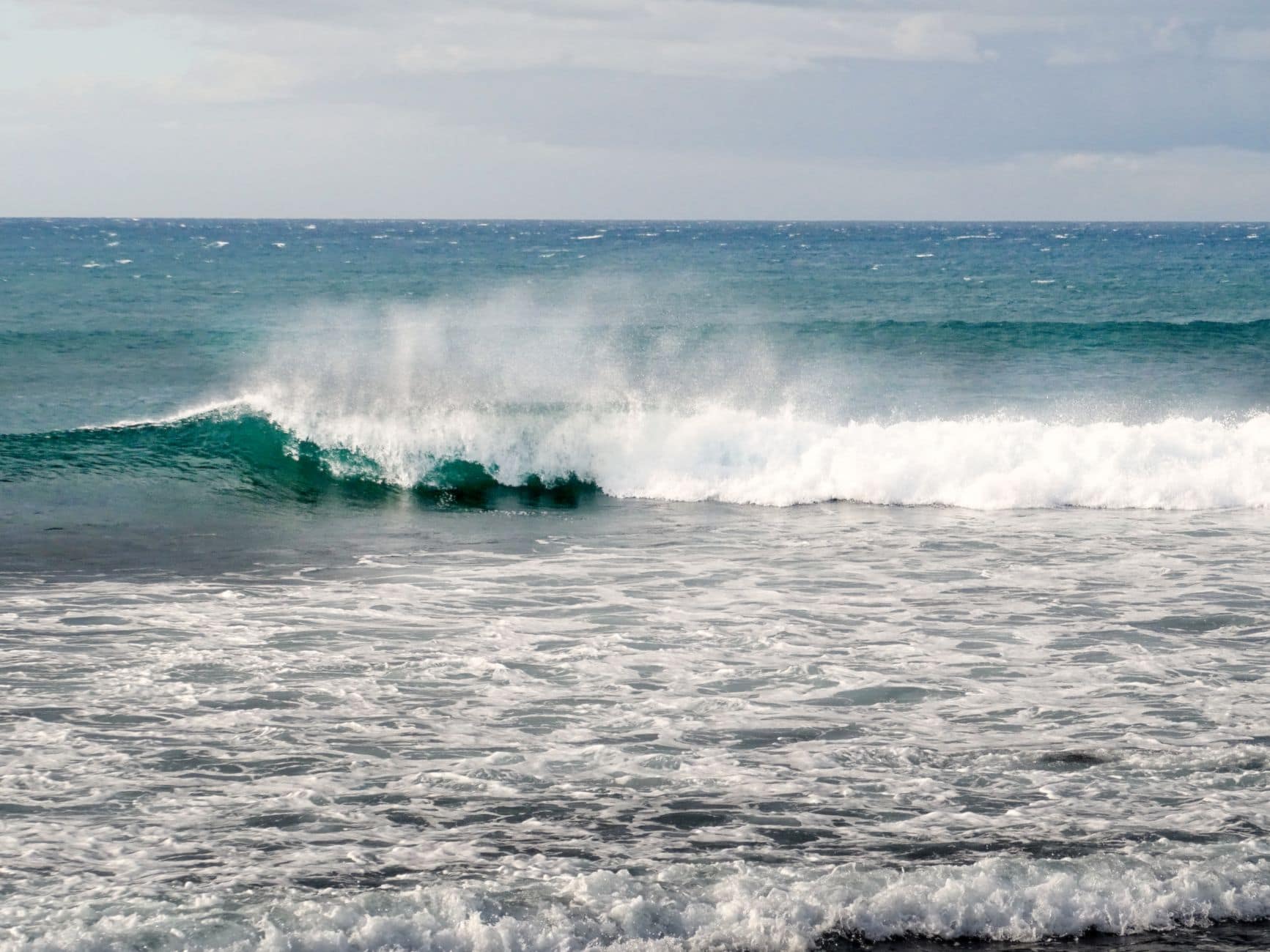 Captivating view of ocean waves crashing at Las Canteras Beach, Gran Canaria.