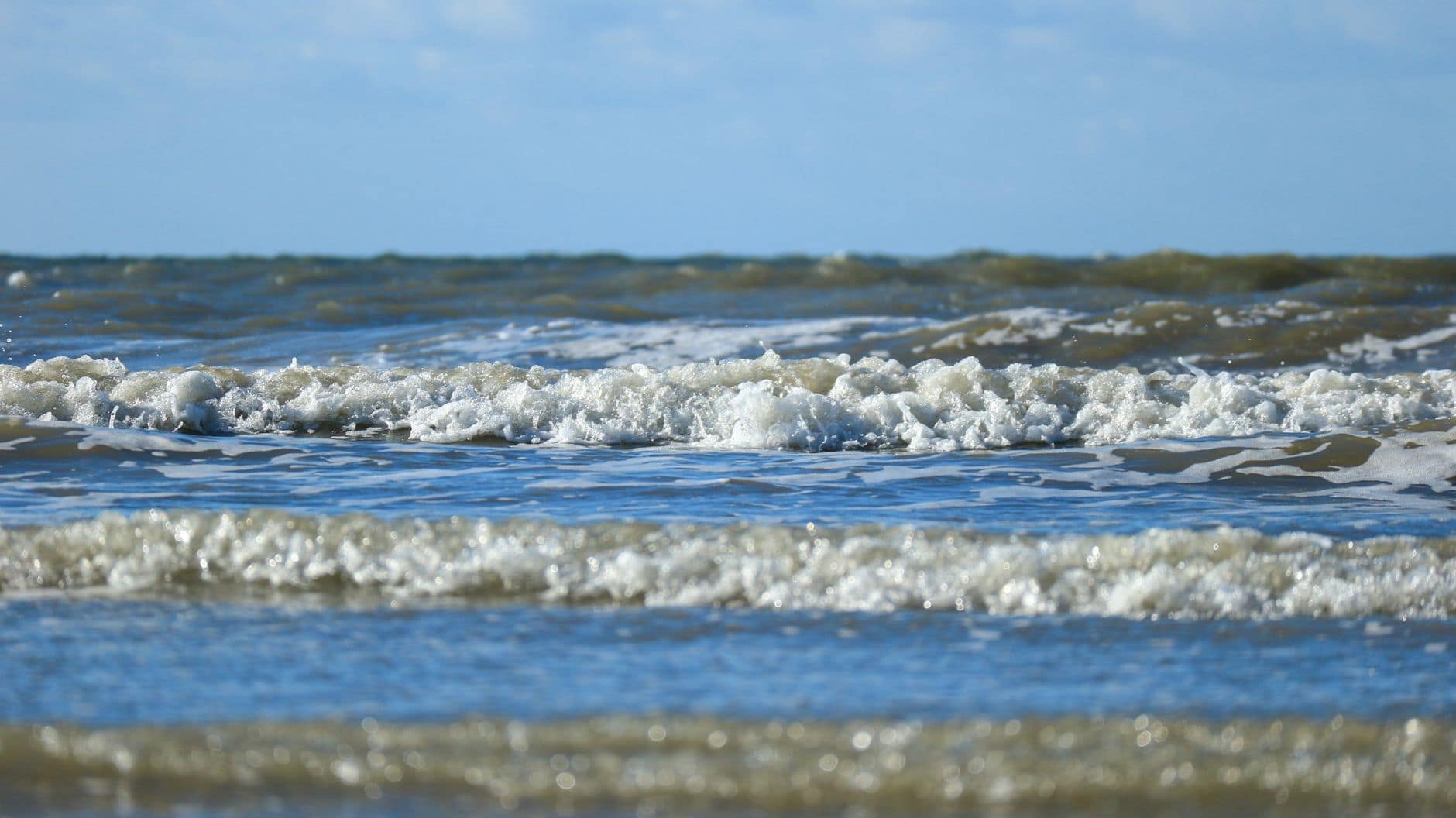 Captivating view of ocean waves crashing on the shore at Fort-Mahon-Plage, France.