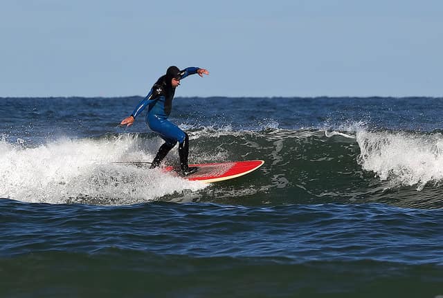A surfer at Pease Bay