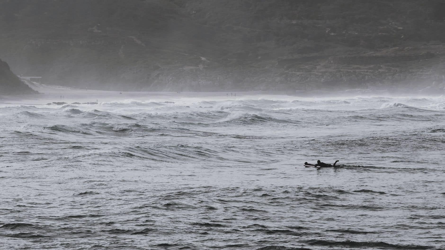 Surfers ride the dynamic waves of Ericeira Beach in Portugal, showcasing adventure in nature.