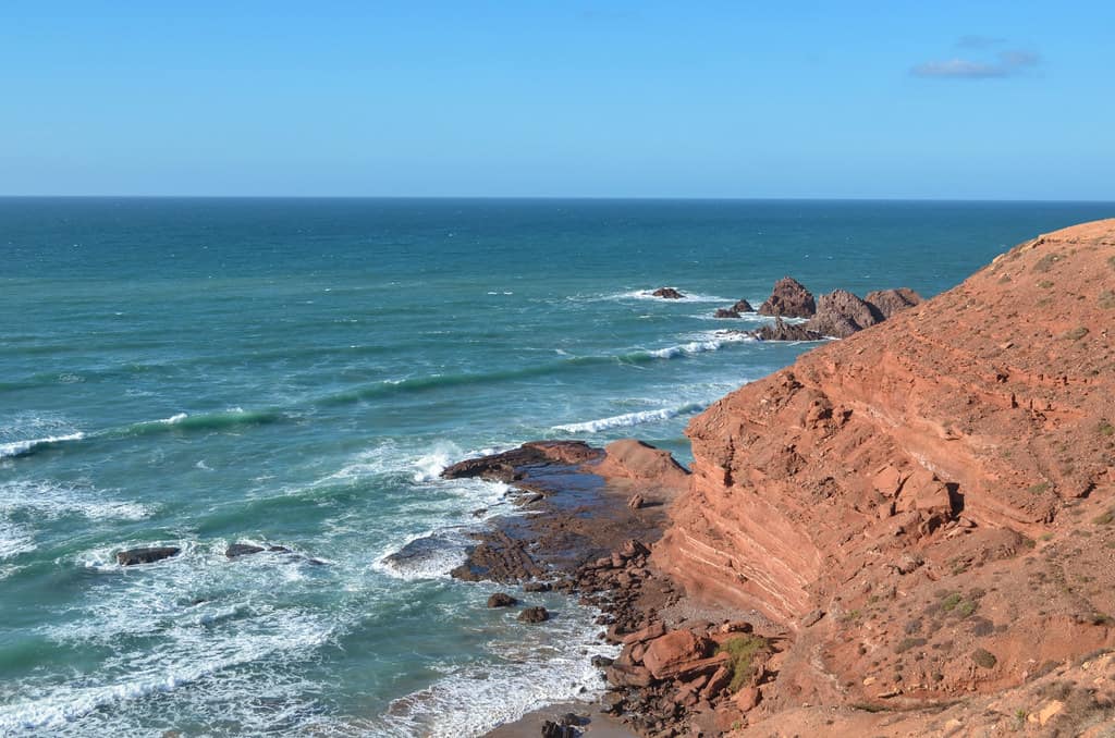 Cycling along the coast of Legzira, Morocco