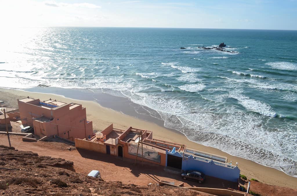 Cycling along the coast of Legzira, Morocco